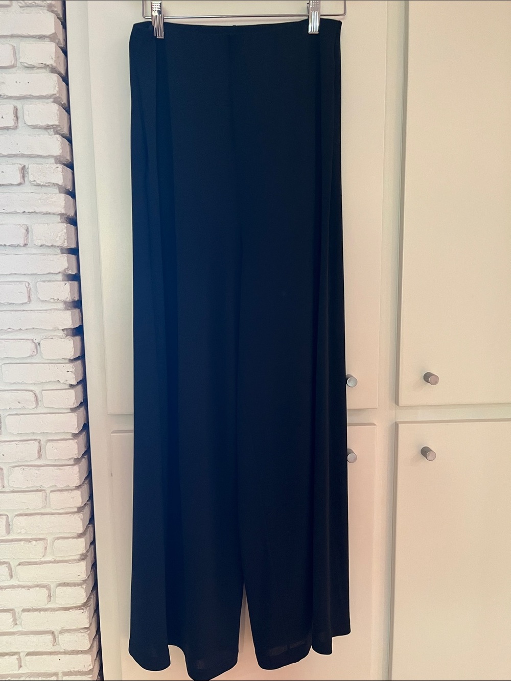 Wolford pants. Black with pockets and wide elastic waistband. Size Small.
